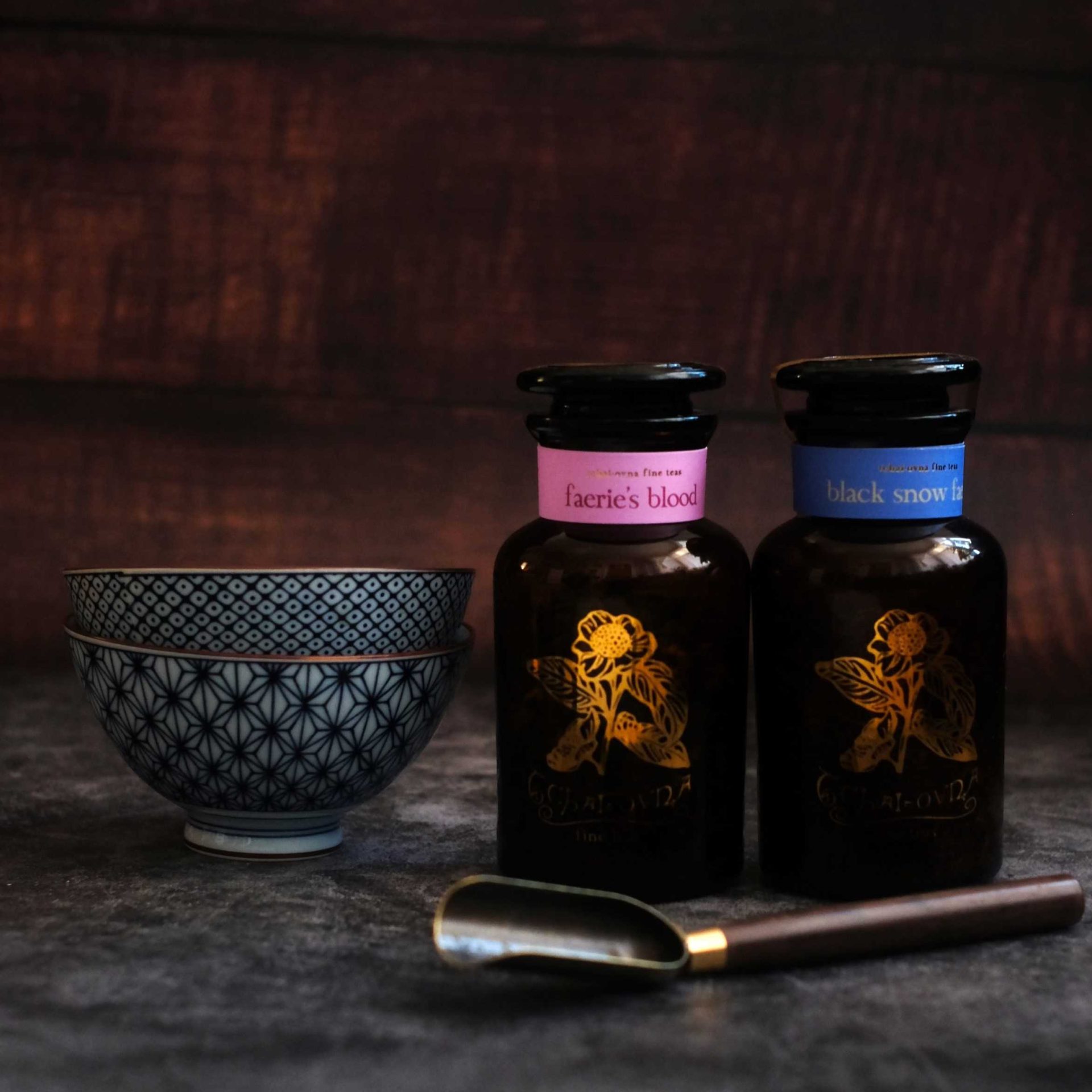A photo of jars of tea and teaware contained in the Tchai-Ovna Faeries Tea Hamper