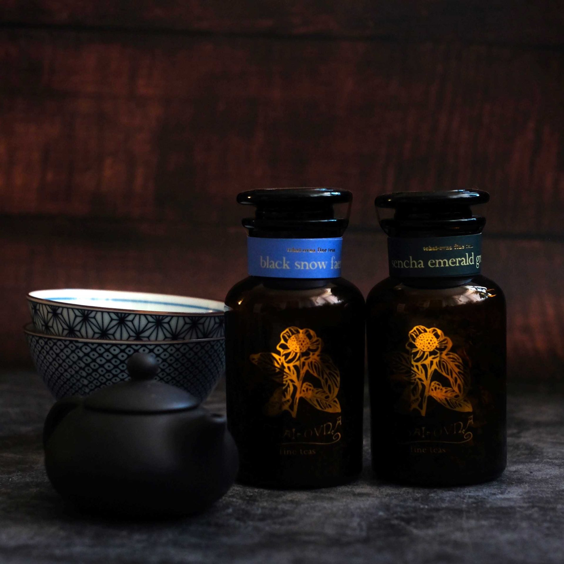 Photo of two jars of single origin, loose leaf tea, a teapot and teacups, included in Tchai-Ovna's Single Origin Tea Hamper